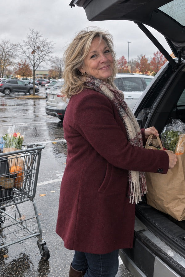 Customer photo of Linda Thompson in a burgundy wool coat while running errands