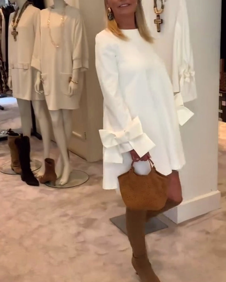 NIA – ELEGANT BOW-SLEEVE MINI DRESS